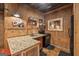 Rustic kitchenette featuring granite countertops, brick wall, and appliances at 172 Sam Solomon Rd, Locust Grove, GA 30248