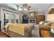 Comfortable living room with a stone fireplace, ceiling fan, and French doors at 172 Sam Solomon Rd, Locust Grove, GA 30248