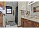 Cozy bathroom features a dark shower curtain, medicine cabinet, sink, and toilet at 439 Elder St, Fairburn, GA 30213