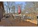 Inviting wooden deck with outdoor seating, dining table, umbrella, and grill, perfect for entertaining guests at 439 Elder St, Fairburn, GA 30213