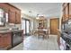 View of eat-in kitchen showcasing dark cabinets, tile floor, and French doors to the backyard at 439 Elder St, Fairburn, GA 30213