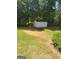 Backyard view of a storage shed with lawn at 65 Coldwater Way, Covington, GA 30016