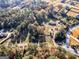 Aerial view of a property surrounded by mature trees and greenery at 434 Lees Lake Rd, Fayetteville, GA 30214