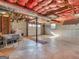 Unfinished basement with exposed ceiling, concrete floor, and garage door at 434 Lees Lake Rd, Fayetteville, GA 30214