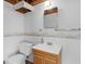 Bathroom featuring a vanity with sink and mirror, with wainscoting and a toilet at 434 Lees Lake Rd, Fayetteville, GA 30214