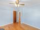 Bedroom with hardwood floors and doors leading to other rooms at 434 Lees Lake Rd, Fayetteville, GA 30214