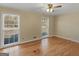 Bedroom with hardwood floors and natural light from large windows at 434 Lees Lake Rd, Fayetteville, GA 30214