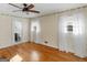 Charming bedroom with hardwood floors, decorative wallpaper and bathroom access at 434 Lees Lake Rd, Fayetteville, GA 30214