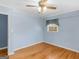 Bright bedroom featuring hardwood floors and a large window at 434 Lees Lake Rd, Fayetteville, GA 30214