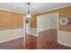 View of the dining room featuring hardwood floors, bright walls, and a chandelier at 434 Lees Lake Rd, Fayetteville, GA 30214