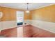 Dining area features hardwood floors, a window providing natural light, and a modern chandelier at 434 Lees Lake Rd, Fayetteville, GA 30214