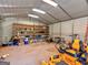 Interior of storage building with lawn equipment, shelving, and fluorescent lighting at 434 Lees Lake Rd, Fayetteville, GA 30214