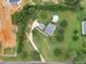 Aerial view of the property showcasing its large lot, lush landscaping, and above-ground pool at 2110 Mcgarity Rd, Mcdonough, GA 30252