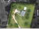 Aerial view of property showcasing the home, above-ground pool, and lush green landscaping at 2110 Mcgarity Rd, Mcdonough, GA 30252