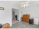 A bonus room with tile flooring, neutral walls, and a small wooden cabinet for storage at 2110 Mcgarity Rd, Mcdonough, GA 30252