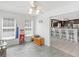 Bright breakfast nook with tile floors, a ceiling fan, and views into a modern kitchen at 2110 Mcgarity Rd, Mcdonough, GA 30252