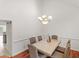 Dining room featuring hardwood floors and a stylish chandelier and marble table at 2110 Mcgarity Rd, Mcdonough, GA 30252