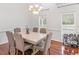 Charming dining room with hardwood floors, stylish chairs, and view to the exterior at 2110 Mcgarity Rd, Mcdonough, GA 30252