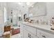 Bright bathroom featuring marble walls, a walk-in shower, and double vanities with updated fixtures at 2405 Hillside Ave, Decatur, GA 30032
