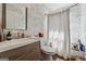 Well-lit bathroom featuring stylish vanity with marble tile backsplash and neutral paint throughout at 2405 Hillside Ave, Decatur, GA 30032