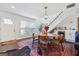 Bright dining area featuring a staircase, large windows, and beverage cooler at 2405 Hillside Ave, Decatur, GA 30032