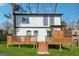 Two-story home with an attached wooden deck and a well-maintained lawn at 2405 Hillside Ave, Decatur, GA 30032