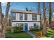 Charming two-story home with a welcoming blue door and fresh green lawn at 2405 Hillside Ave, Decatur, GA 30032