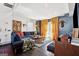 Comfortable living room with a large blue sectional sofa and natural light at 2405 Hillside Ave, Decatur, GA 30032
