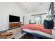 Bright bedroom featuring a decorative rug, a ceiling fan, and dark wood floors that add warmth and character at 2405 Hillside Ave, Decatur, GA 30032