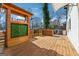 Wooden deck with outdoor kitchen featuring a sink, counter space, and greenery wall at 2405 Hillside Ave, Decatur, GA 30032