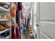 Organized walk-in closet with clothing racks, shelving, and natural light from a window at 2405 Hillside Ave, Decatur, GA 30032