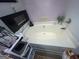 Features a large, white garden tub under a window at 1687 Blue Heron Way, Hampton, GA 30228