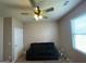 Standard bedroom with ceiling fan, a couch and mini-blinds at 1687 Blue Heron Way, Hampton, GA 30228