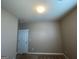 Neutral toned bedroom featuring standard closet and entry doors at 1687 Blue Heron Way, Hampton, GA 30228