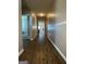 Hallway with laminate flooring at 1687 Blue Heron Way, Hampton, GA 30228