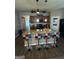 Kitchen island with granite countertop and four colorful bar stools at 1687 Blue Heron Way, Hampton, GA 30228