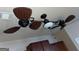 Modern kitchen ceiling fan with custom wicker-like blades and light at 1687 Blue Heron Way, Hampton, GA 30228