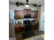 Well-equipped kitchen with granite countertops and sleek black appliances at 1687 Blue Heron Way, Hampton, GA 30228