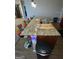 Large kitchen island with granite countertops and colorful modern barstools at 1687 Blue Heron Way, Hampton, GA 30228