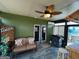 Cozy sunroom features a ceiling fan and tiki bar at 1687 Blue Heron Way, Hampton, GA 30228