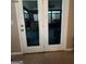 View through double doors to sunroom with bar at 1687 Blue Heron Way, Hampton, GA 30228