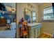 Charming bathroom with double mirrors, wood vanity and access to the primary bedroom at 3579 Bill Gardner Pkwy, Locust Grove, GA 30248