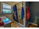 Modern bathroom with a tiled shower, window, and decorative shower curtain at 3579 Bill Gardner Pkwy, Locust Grove, GA 30248