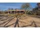 Cozy one-story house with a rustic stone chimney and spacious dirt driveway at 3579 Bill Gardner Pkwy, Locust Grove, GA 30248