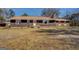 Charming single-story home featuring a long front porch and spacious lawn at 3579 Bill Gardner Pkwy, Locust Grove, GA 30248