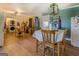 Utility room with a washer, stainless steel refrigerator, wooden table and bright lighting at 3579 Bill Gardner Pkwy, Locust Grove, GA 30248