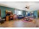 Spacious living area with wood floors, comfortable seating, and plenty of natural light at 3579 Bill Gardner Pkwy, Locust Grove, GA 30248