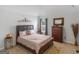 A bedroom with a queen bed, dresser, neutral carpet and light gray walls at 108 Donovan Ave, Locust Grove, GA 30248