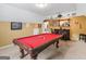 Large rec room with a pool table, a wet bar, and lots of space for entertaining at 108 Donovan Ave, Locust Grove, GA 30248