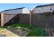 Fenced backyard with a concrete patio and small patches of grass at 1235 Labonte Pkwy, Mcdonough, GA 30253